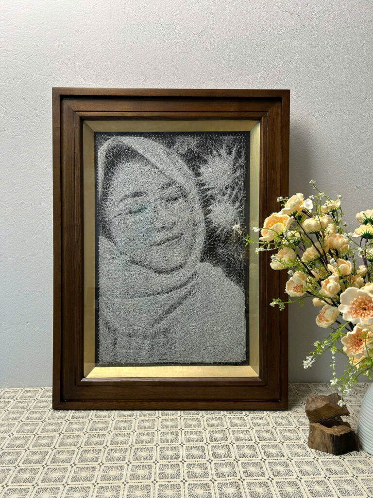 Tranh dây chân dung đinh chỉ